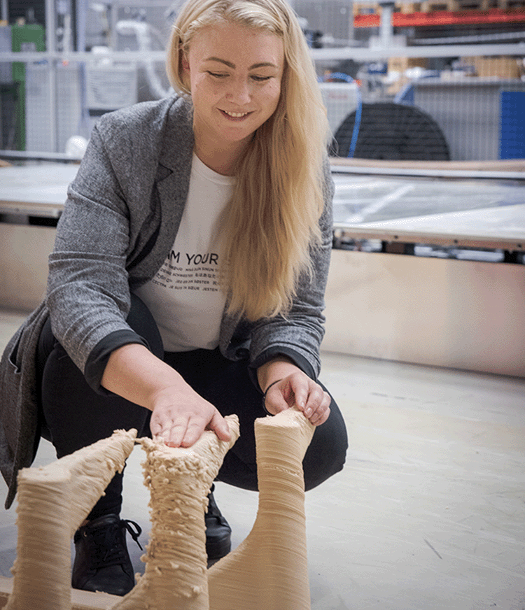 Normada founder Johanna Vesterberg inspects 3D printed furniture prototypes to understand how machine speed effects layering quality